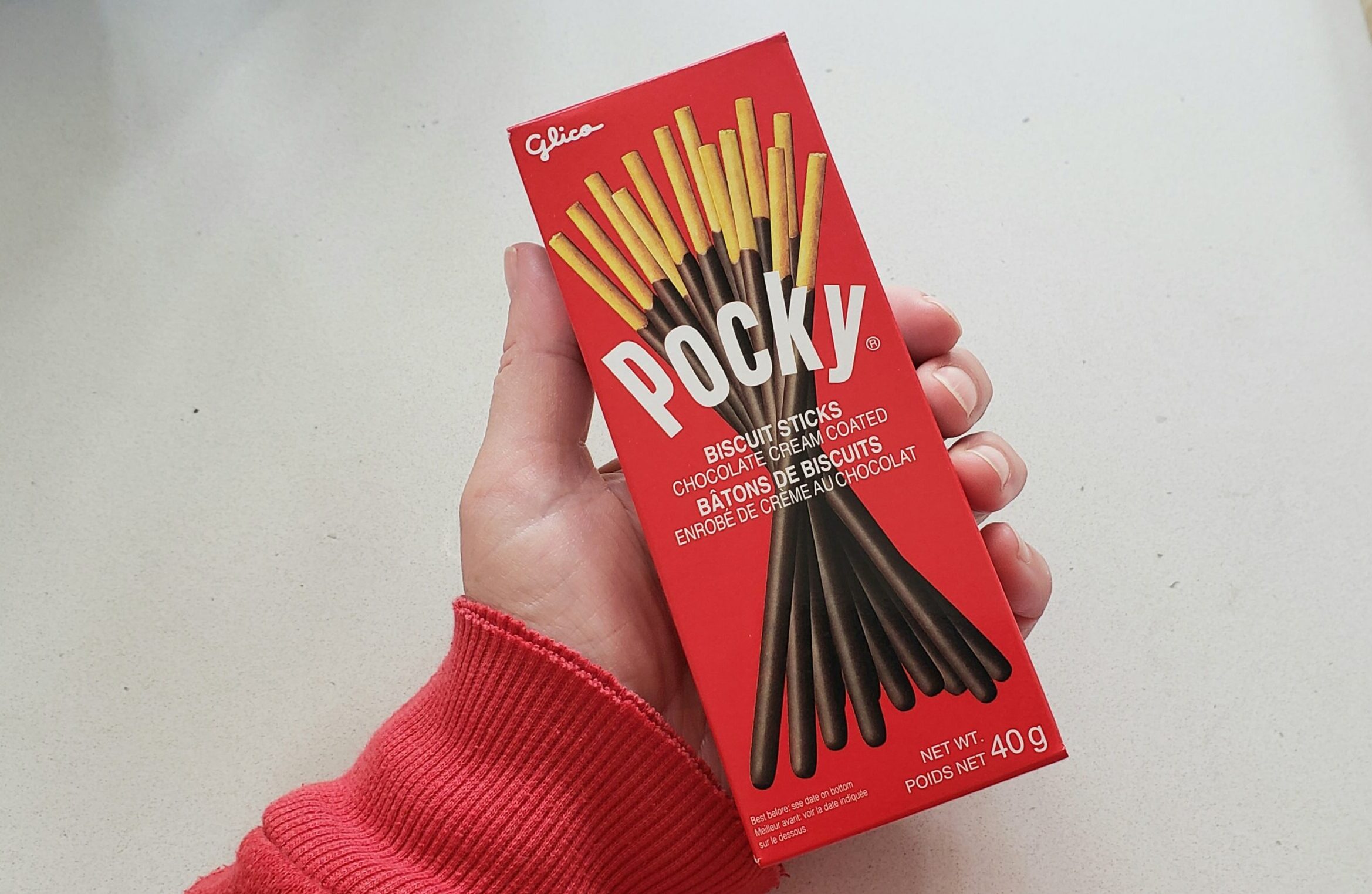 Photo of hand holding Pocky