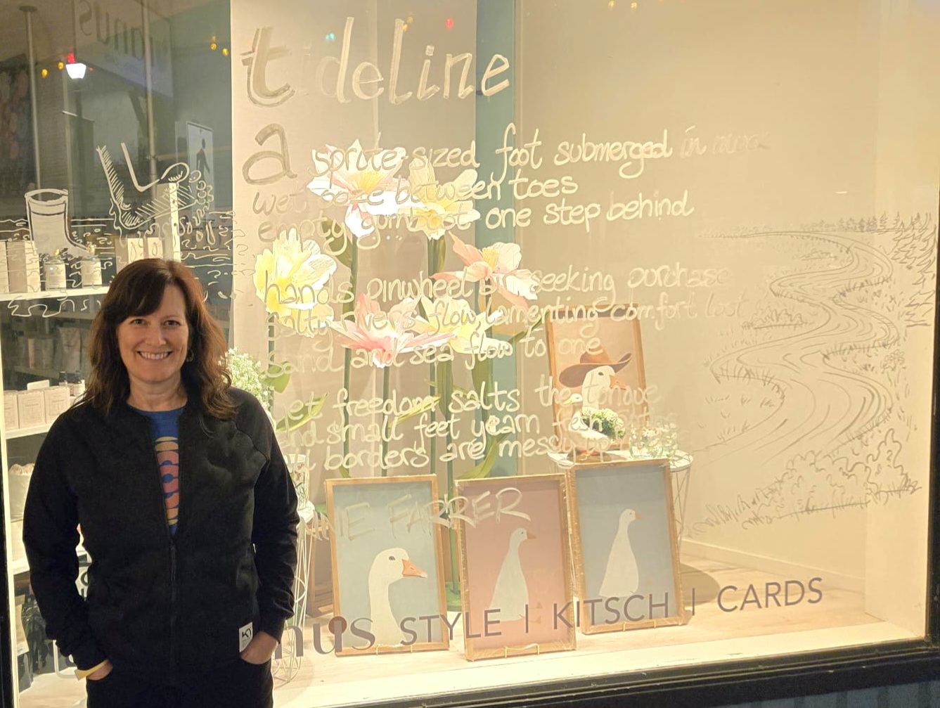 Colour photo of Anne Farrer with tideline poem